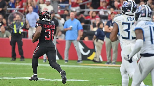Oct 5, 2025; Glendale, Arizona, USA; Arizona Cardinals running back Emari Demercado (31) runs the ball for 71 yards before fumbling against the Tennessee Titans during the fourth quarter at State Farm Stadium. Mandatory Credit: Matt Kartozian-Imagn Images