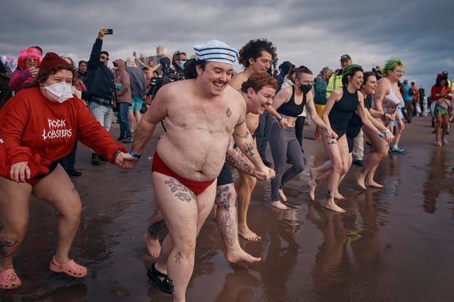 FILE - Revelers enter the cold water during the annual Polar Bear Plunge on New Year's Day, Jan. 1, 2025, in New York. (AP Photo/Andres Kudacki, file)