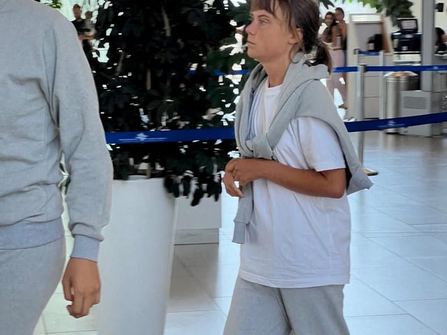 Swedish activist Greta Thunberg walks through Ramon International Airport before her deportation flight, near Eilat, Israel, after Israel intercepted the vessels of the Global Sumud Flotilla aiming to reach Gaza and break Israel's naval blockade, October 6, 2025 in this handout image. Israel Foreign Ministry/Handout via REUTERS THIS IMAGE HAS BEEN SUPPLIED BY A THIRD PARTY. NO RESALES. NO ARCHIVES. MANDATORY CREDIT.