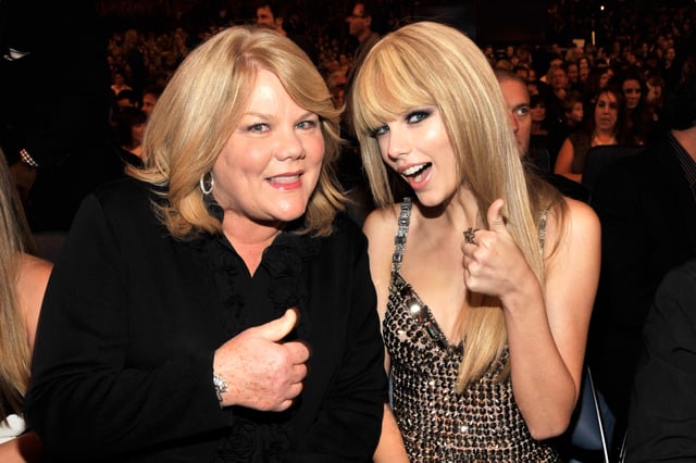 Andrea Swift and daughter Taylor Swift pose for a photo in the audience at the 2010 American Music Awards held at the Nokia Theatre L.A. Live on November 21, 2010 in Los Angeles, California.