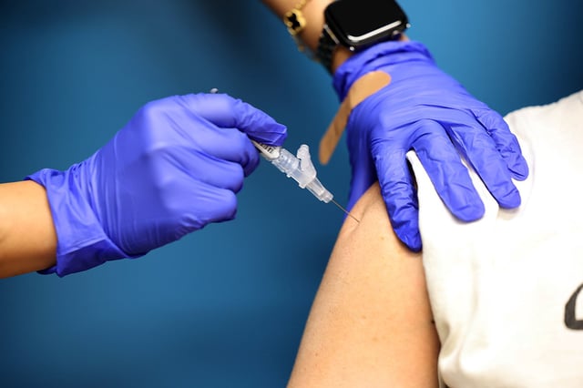 Christian Brown receives a COVID-19 vaccine in Culver City, Calif., on Sept. 23, 2025.