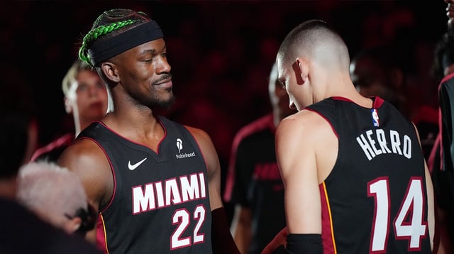 Jan 2, 2025; Miami, Florida, USA; Miami Heat forward Jimmy Butler (22) and guard Tyler Herro (14) are introduced during pregame ceremonies before the game against the Indiana Pacers at Kaseya Center. Mandatory Credit: Jim Rassol-Imagn Images