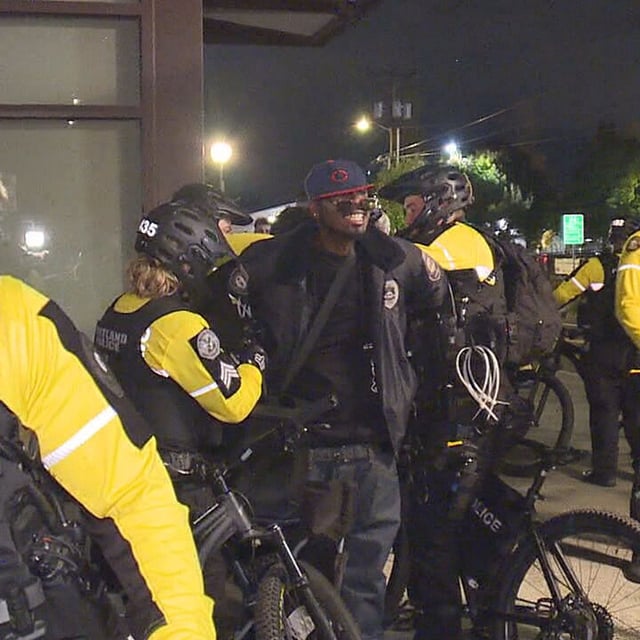 Portland police officers arrest a man near the ICE facility on Friday night, Oct. 3, 2025. They said he was blocking the street. (KATU)