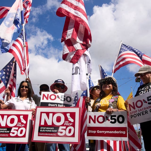 Opponents of California Proposition 50, also known as the Election Rigging Response Act, a California ballot measure that would redraw congressional maps to benefit Democrats, rally in Westminster, Calif., on Wednesday, Sept. 10, 2025. (AP Photo/Damian Dovarganes)