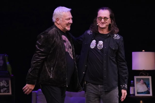 Geddy Lee (R) stands on stage with fellow Rush band member Alex Lifeson, as Lee promotes his book 'My Effin' Life' in Toronto, on Thursday, Dec. 7, 2023.