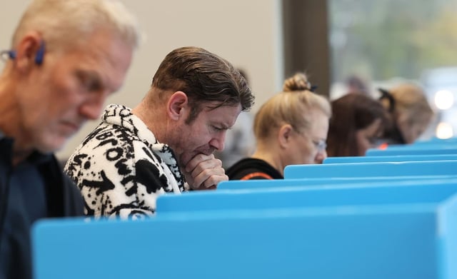 Voters cast their ballots at City Hall in Cottonwood Heights on Tuesday, Nov. 5, 2024.