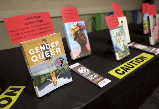 A selection of banned and challenged books are seen on a table as members of City Lit Theater Company read excerpts from them during Banned Books Week 2022, at the Lincoln Belmont branch of the Chicago Public Library on Sept. 22, 2022.