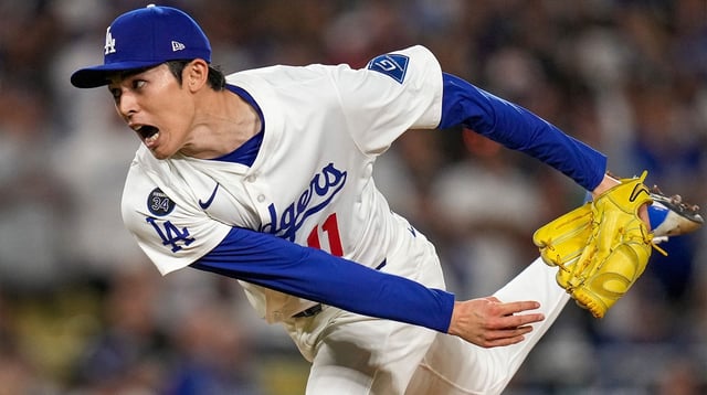 Los Angeles Dodgers pitcher Roki Sasaki (11) throws a pitch in the ninth inning of the MLB National League Wild Card Game 2 between the Los Angeles Dodgers and the Cincinnati Reds at Dodger Stadium in Los Angeles on Wednesday, Oct. 1, 2025. The Reds were eliminated from the postseason with an 8-4 loss to the reining World Series Champions La Dodgers. Sam Greene/The Enquirer / USA TODAY NETWORK via Imagn Images