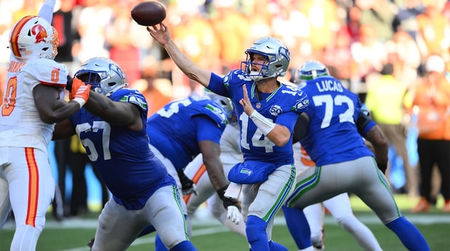 Oct 5, 2025; Seattle, Washington, USA; Seattle Seahawks quarterback Sam Darnold (14) throws downfield against the Tampa Bay Buccaneers during the second half at Lumen Field. Mandatory Credit: Steven Bisig-Imagn Images