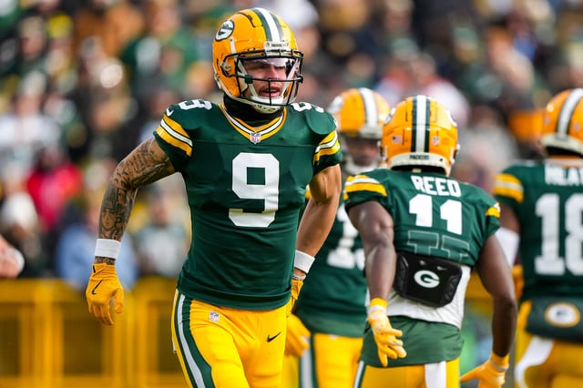 GREEN BAY, WISCONSIN - JANUARY 5: Wide receiver Christian Watson #9 of the Green Bay Packers gets set during the first quarter of an NFL football game against the Chicago Bears, at Lambeau Field on January 5, 2025 in Green Bay, Wisconsin. (Photo by Todd Rosenberg/Getty Images)