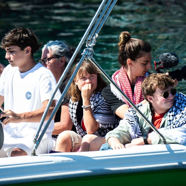 Climate activist Greta Thunberg, center, waits to board the Madleen boat, before setting sail for Gaza along with activists of the Freedom Flotilla Coalition, departing from the Sicilian port of Catania, Italy, Sunday, June 1, 2025. (AP Photo/Salvatore Cavalli)