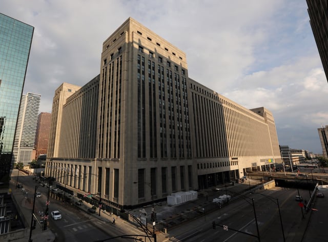 The Old Post Office, center, in downtown Chicago, is seen Aug 19, 2019. Uber Technologies has decided to pause construction on its office space in the building.