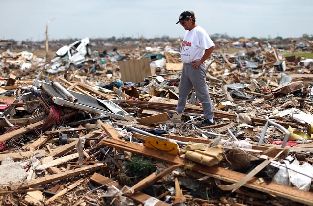 Homeowner Russell Shearer looks over the rubble of his destroyed home on May 24, 2013 in Moore, Oklahoma.