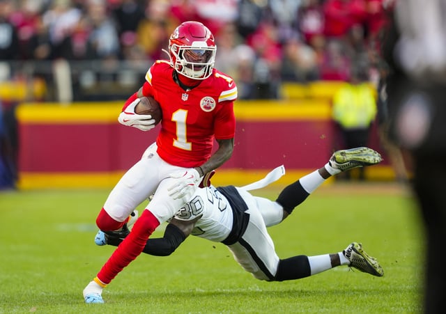 Nov 29, 2024; Kansas City, Missouri, USA; Kansas City Chiefs wide receiver Xavier Worthy (1) runs with the ball against Las Vegas Raiders cornerback Darnay Holmes (30) during the first half at GEHA Field at Arrowhead Stadium. Mandatory Credit: Jay Biggerstaff-Imagn Images/ File Photo