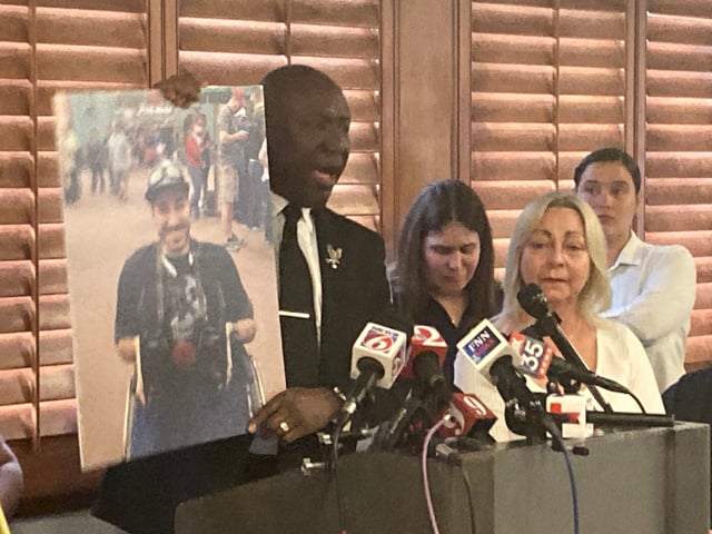 Attorney Ben Crump shows a photo of Kevin Rodriguez Zavala, 32, on Monday, Oct. 6, during a press conference at the Crowne Plaza Orlando Downtown hotel. He is standing alongside members of Zavala’s family and his legal team. Zavala, who loved Star Wars and roller coasters, died Sept. 17 after riding Universal Orlando Resort’s new thrill ride Stardust Racers. (Martin E. Comas/Orlando Sentinel)