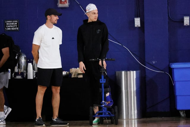 Heat guard Tyler Herro is seen using a scooter during the opening day of training camp, Tuesday, Sept. 30, 2025 at Florida Atlantic University in Boca Raton. (Joe Cavaretta/South Florida Sun Sentinel)
