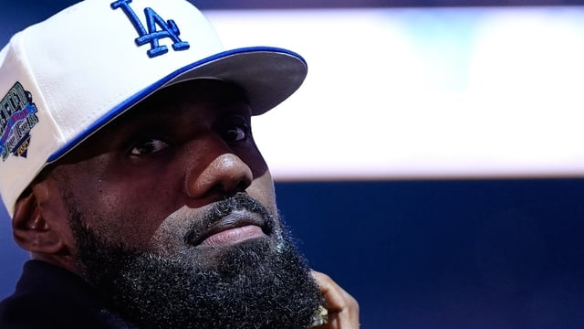 Los Angeles Lakers' Lebron James stands on the court before an NBA basketball preseason game against the Golden State Warriors, 