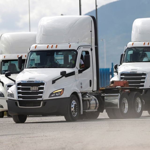 A worker drives a cargo truck at the Daimler Freightliner truck assembly plant, after U.S. President Donald Trump announced on Thursday that he would impose a 25% duty on imports of heavy-duty trucks starting October 1, in Derramadero, Coahuila state, Mexico, September 27, 2025. REUTERS/Antonio Ojeda