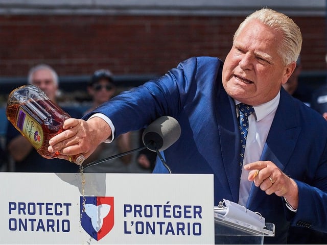 Ontario Premier Doug Ford empties a Crown Royal bottle of whisky at a press conference in Kitchener, Ont., on Tuesday, Sept. 2, 2025. Ford criticized the popular whisky's parent company, Diageo, for its plan to close its bottling plant in Amherstburg in early 2026.