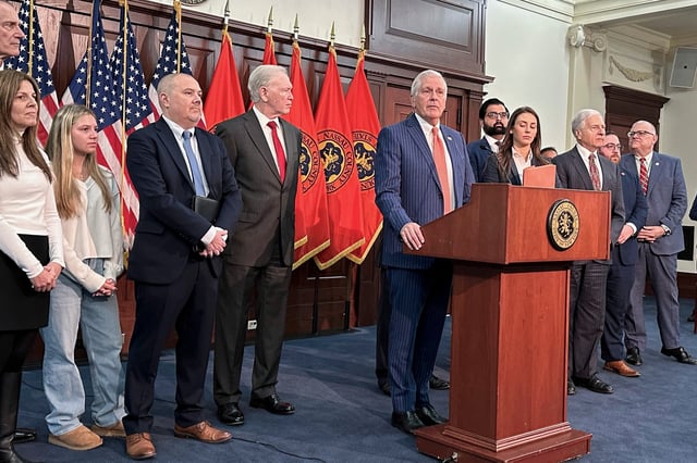 FILE - Nassau County Executive Bruce Blakeman, at podium, speaks during a news conference Wednesday, March 6, 2024, in Mineola, N.Y. (AP Photo/Philip Marcelo, File)