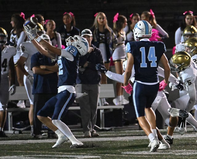 Corona del Mar’s Garrett James (12) makes a reception against San Juan Hills on Friday, Oct. 3, 2025, at Newport Harbor High. (Photo by Steven Georges, Contributing Photographer)