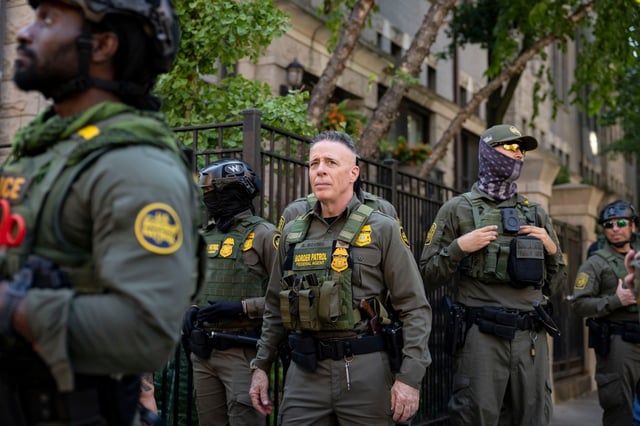 Gregory Bovino, a U.S. Border Patrol official, stands with other federal agents near the Newberry Library in Chicago’s Gold Coast on Sept. 28, 2025, after walking through downtown as part of an immigration blitz show of force. (Brian Cassella/Chicago Tribune)