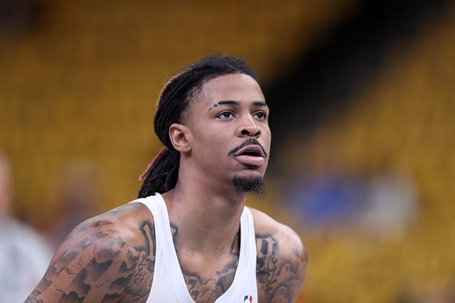 MEMPHIS, TENNESSEE - APRIL 24: Ja Morant #12 of the Memphis Grizzlies warms up against the Oklahoma City Thunder during Game Three of the Western Conference First Round NBA Playoffs at FedExForum on April 24, 2025 in Memphis, Tennessee. NOTE TO USER: User expressly acknowledges and agrees that, by downloading and or using this photograph, User is consenting to the terms and conditions of the Getty Images License Agreement. (Photo by Justin Ford/Getty Images)