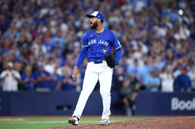 TORONTO, ONTARIO - OCTOBER 05: Seranthony Domínguez #48 of the Toronto Blue Jays reacts during the ninth inning in game two of the American League Division Series against the New York Yankees at Rogers Centre on October 05, 2025 in Toronto, Ontario. (Photo by Vaughn Ridley/Getty Images)