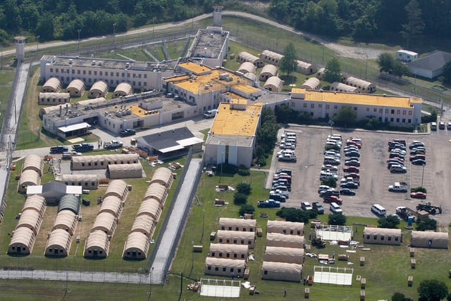 FILE - In this May 9, 2011 file photo, the Louisiana State Penitentiary at Angola is seen in West Feliciana Parish, La. U.S. District Judge Brian Jackson expressed frustration as he questioned why prison officials won't spend roughly $1 million to install air conditioning on death row, since the state has already spent much more to fight this in court. (AP Photo/Patrick Semansky, File)