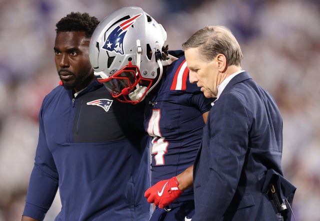 ORCHARD PARK, NEW YORK - OCTOBER 05: Antonio Gibson #4 of the New England Patriots is checked on by medical staff during the game against the Buffalo Bills at Highmark Stadium on October 05, 2025 in Orchard Park, New York. (Photo by Bryan M. Bennett/Getty Images)