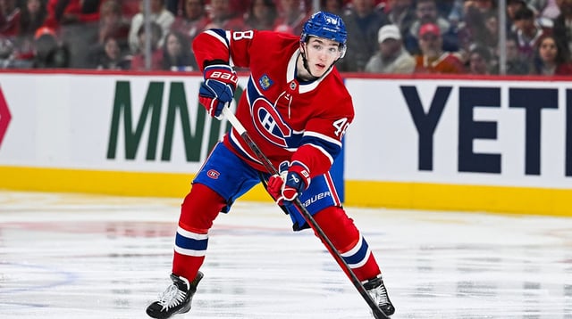Apr 27, 2025; Montreal, Quebec, CAN; Montreal Canadiens defenseman Lane Hutson (48) considers his options with the puck against the Washington Capitals during the third period in game four of the first round of the 2025 Stanley Cup Playoffs at Bell Centre. Mandatory Credit: David Kirouac-Imagn Images