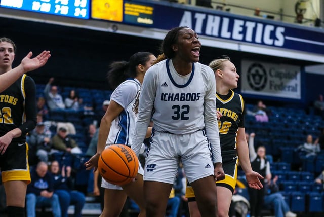 Washburn's Yiibari Nwidadah celebrates after making a basket and foul against Missouri Western at Lee Arena on Jan. 4.