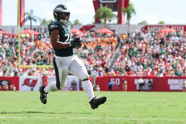 Sep 28, 2025; Tampa, Florida, USA; Philadelphia Eagles running back Saquon Barkley (26) runs with the ball for a touchdown during the third quarter against the Tampa Bay Buccaneers at Raymond James Stadium. Mandatory Credit: Nathan Ray Seebeck-Imagn Images/ File Photo