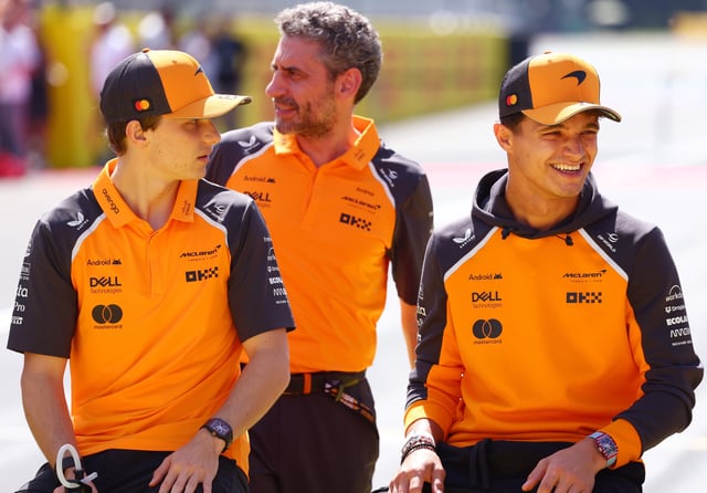 MONZA, ITALY - SEPTEMBER 07: Oscar Piastri of Australia and McLaren Andrea Stella, Team Principal of McLaren and Lando Norris of Great Britain and McLaren on the drivers parade prior to the F1 Grand Prix of Italy at Autodromo Nazionale Monza on September 07, 2025 in Monza, Italy. (Photo by Clive Rose/Getty Images)