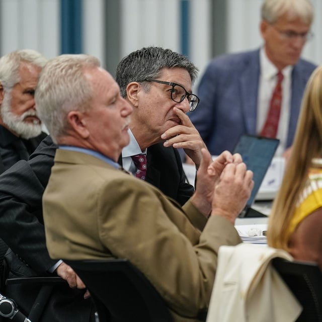 CHAMBLEE, GEORGIA - SEPTEMBER 19: James Pagano, (C), listens to a speaker during a meeting of the CDC's Advisory Committee on Immunization Practices on September 19, 2025 in Chamblee, Georgia. The federal vaccine advisory group, recently appointed by Health Secretary Robert F. Kennedy Jr., is to make recommendations on who should get COVID shots and whether all babies should get vaccinated against hepatitis B at birth. (Photo by Elijah Nouvelage/Getty Images)