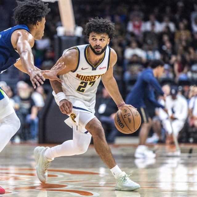 Minnesota Timberwolves guard Jaylen Clark, left, defends Denver Nuggets guard Jamal Murray (27) during the first half of a preseason NBA basketball game Saturday, Oct. 4, 2025, in San Diego. (AP Photo/Tony Ding)