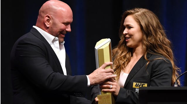 Dana White presents Ronda Rousey with an award at the 2018 UFC Hall of Fame induction ceremony. Credit: Ethan Miller/Getty Images