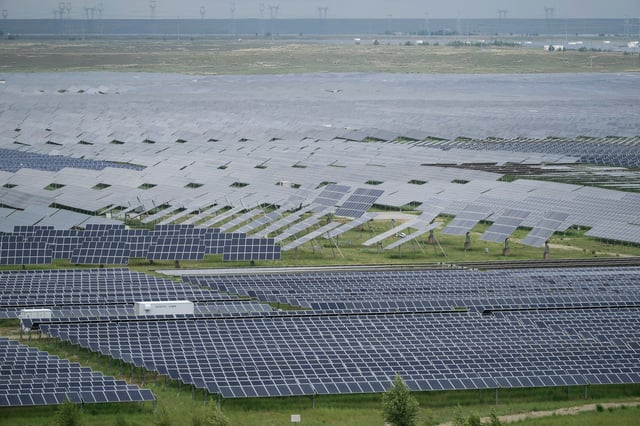 FILE - A solar farm is visible in Hainan prefecture of western China's Qinghai province July 1, 2025. (AP Photo/Ng Han Guan, File)