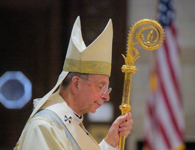 Archbishop William E. Lori lowers his head during a Blue Mass at Saint Joseph's Monastery Campus of Our Lady of Victory Parish. According to a press release, the Catholic Church offers prayers for law enforcement officers, firefighters, paramedics and all public safety professionals, both retired and in active duty. (Karl Merton Ferron/Staff)