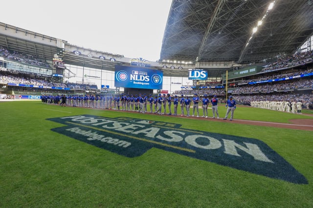 Members of the Chicago Cubs stand on the field during player introductions prior to game one of the National League Division Series against the Milwaukee Brewers at American Family Field on October 04, 2025 in Milwaukee, Wisconsin.