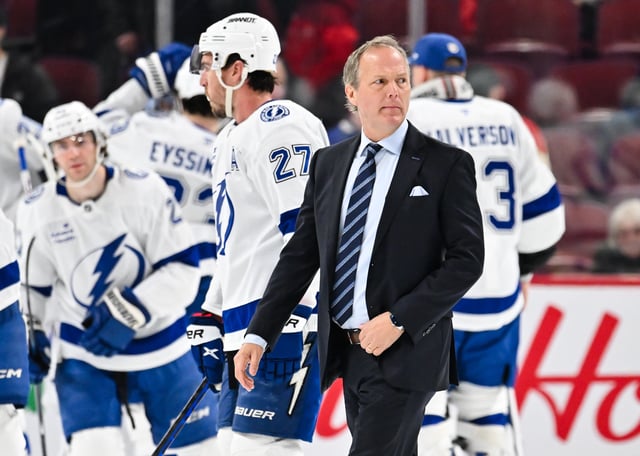 Head coach Jon Cooper of the Tampa Bay Lightning walks across the ice as his team celebrates a victory against the Montreal Canadiens at the Bell Centre on February 9, 2025 in Montreal, Quebec, Canada.  The Tampa Bay Lightning defeated the Montreal Canadiens 5-3.