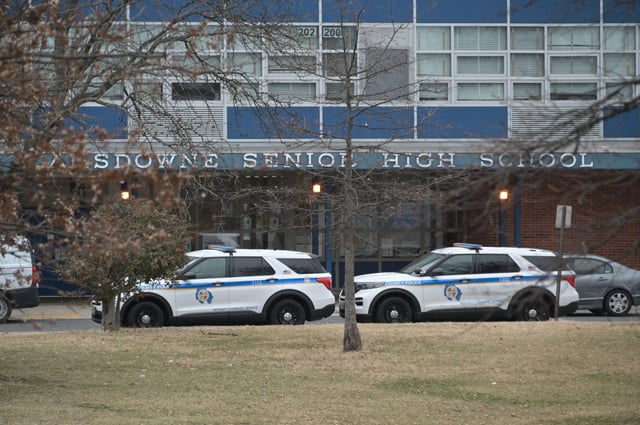 Baltimore County Police cruisers are parked outside Lansdowne High School on Wednesday. On Tuesday afternoon a 16-year-old Lansdowne student was fatally shot in an incident that started at a nearby shopping center then moved onto school property. (Kim Hairston/Staff)