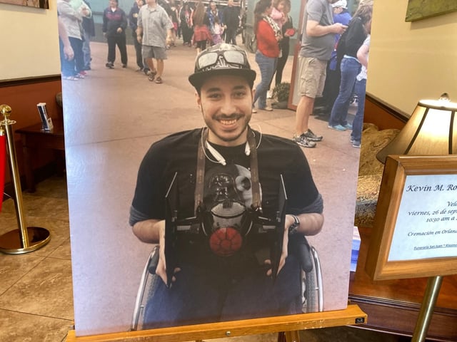 A photo of Kevin Rodriguez Zavala is displayed at his funeral service at Funeraria San Juan Funeral Home in Kissimmee on Friday, Sept. 26, 2025. Zavala, 32, died after riding an Epic Universe roller coaster. (Martin E. Comas/Orlando Sentinel)