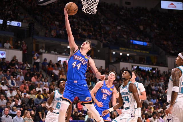 Oct 5, 2025; North Charleston, South Carolina, USA; Oklahoma City Thunder guard Nikola Topic (44) lays up a shot against the Charlotte Hornets in the first quarter at North Charleston Coliseum. Mandatory Credit: Arthur Ellis-Imagn Images