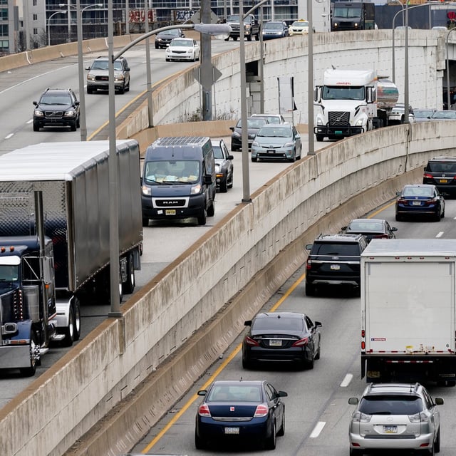FILE - Motor vehicle traffic moves along the Interstate 76 highway in Philadelphia, March 31, 2021. The EPA on Friday, March 29, 2024, set new greenhouse gas emissions standards for heavy-duty trucks, buses and other large vehicles, an action that officials said will clean up some of the nation's largest sources of planet-warming pollution. (AP Photo/Matt Rourke, File)