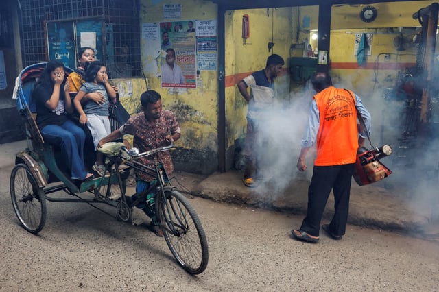 A city corporation worker uses a fumigator to control the spread of mosquitoes, as the number of dengue infected patients increases, in Dhaka, Bangladesh, October 14, 2024. REUTERS/Mohammad Ponir Hossain