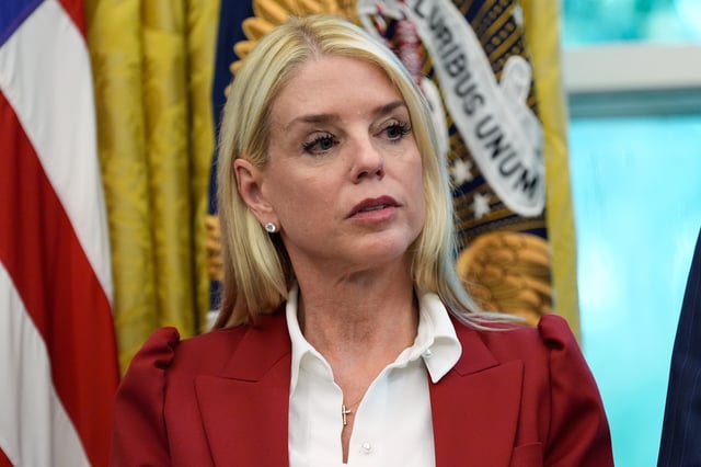 Attorney General Pam Bondi listens as President Donald Trump signs a presidential memorandum on the death penalty in the District of Columbia in the Oval Office at the White House, Thursday, Sept. 25, 2025, in Washington. (AP Photo/Alex Brandon)