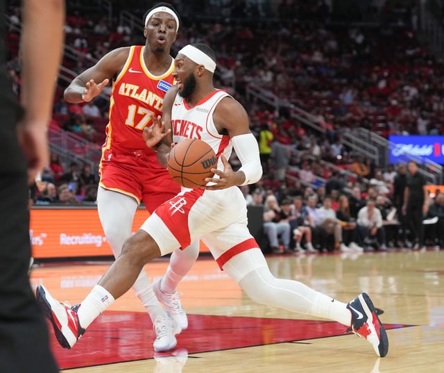 Houston Rockets guard Josh Okogie (20) drives past Houston Rockets forward Tari Eason (17) in the first half of game action at the Toyota Center in Houston on Monday, Oct. 6, 2025.