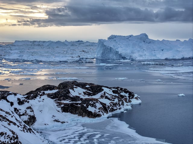 ILULISSAT, GREENLAND - MARCH 10: Icebergs that broke off from the Jakobshavn Glacier float along Disko Bay on March 10, 2025, in Ilulissat, Greenland. The self-ruling Danish territory and world's largest island has been thrust into the geopolitical spotlight as U.S. President Donald Trump has vowed to acquire it, citing its strategic value, drawing objections from Danish and Greenlandic leaders. In his State of the Union address, Trump said the US needed Greenland for national security and would "get it one way or the other," but added that he supported Greenlanders' right to determine their own future. The territory holds its general election on March 11. (Photo by Joe Raedle/Getty Images)