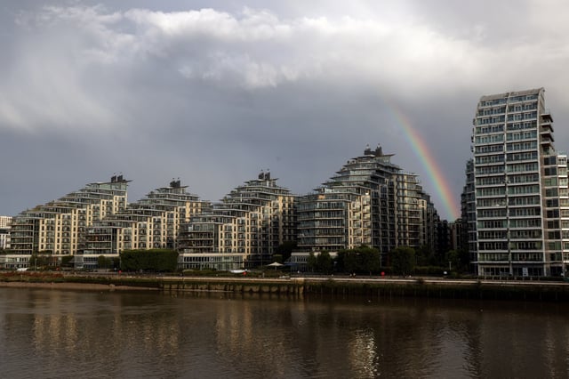 A rainbow is seen over apartments in Wandsworth on the River Thames as UK house prices continue to fall, in London, Britain, August 26, 2023.   REUTERS/Kevin Coombs